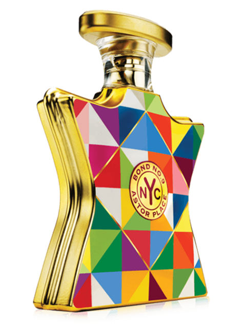 Colorful geometric-patterned perfume bottle with gold accents astor place