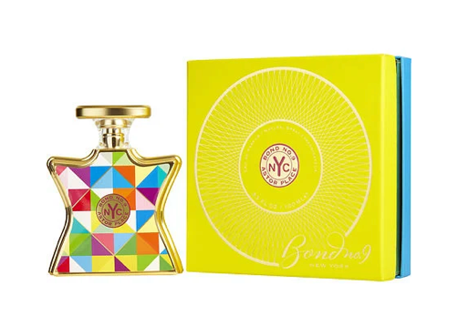 Colorful perfume bottle with geometric design and matching yellow box bond no 9 astor place