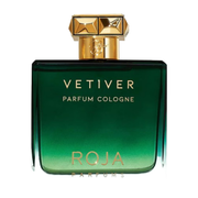 Green and gold parfum cologne bottle with 'Vetiver' and 'Roja' branding on a white background