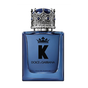 Blue Dolce & Gabbana perfume bottle with decorative cap on a white background